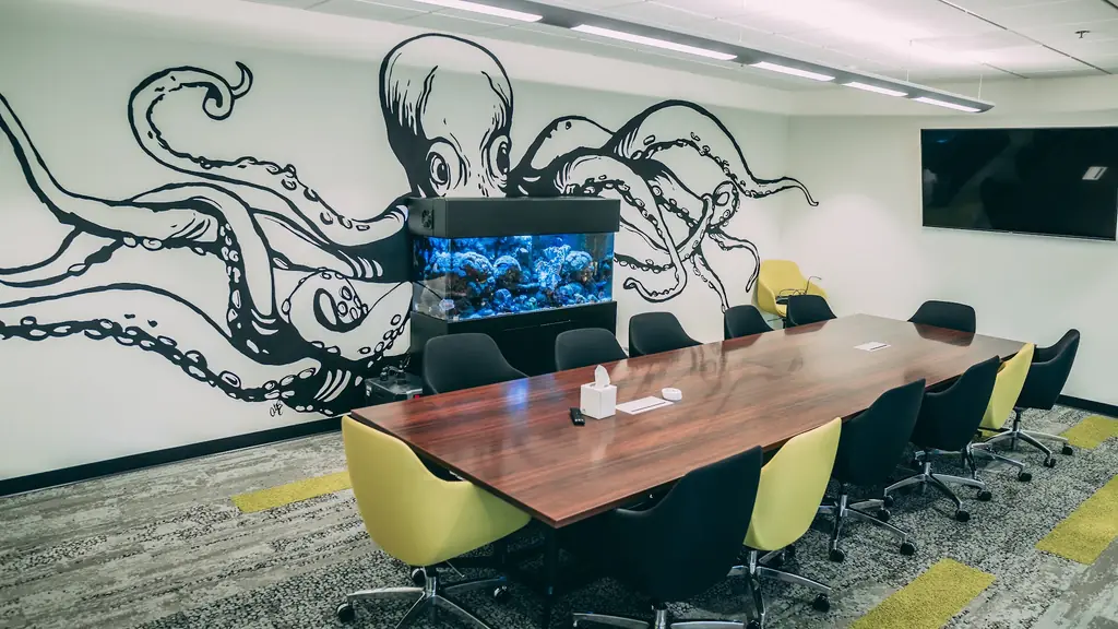 Boardroom at the OctoClean headquarters with the octopus mural