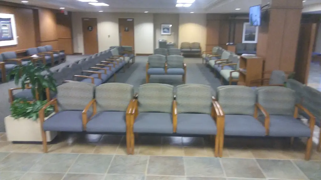 Rows of upholstered chairs in a healthcare waiting area